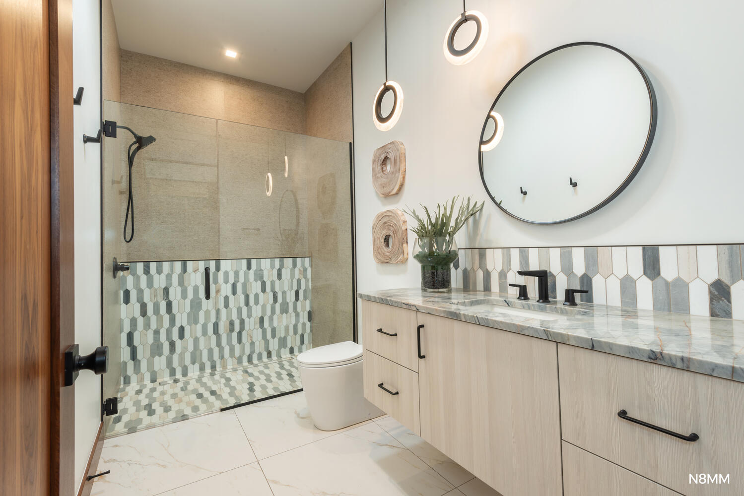 Guest bathroom with vanity and a stall shower