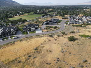 Aerial view of residential area featuring a mountainous background