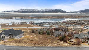 Aerial perspective of suburban area featuring a water and mountain view