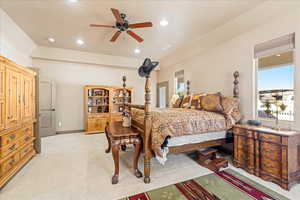 Bedroom featuring light colored carpet, ceiling fan, and recessed lighting