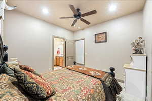 Bedroom with recessed lighting, ensuite bathroom, a ceiling fan, and carpet