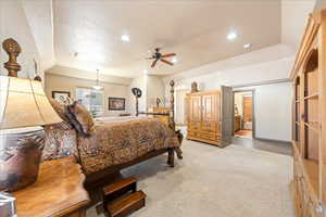 Bedroom with light carpet, ceiling fan, and recessed lighting