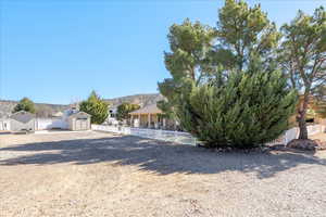 View of front facade with a storage unit and a mountain view