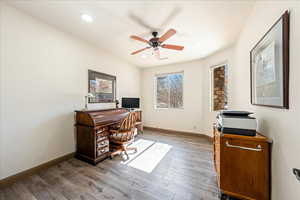 Home office featuring wood finished floors, a ceiling fan, and recessed lighting
