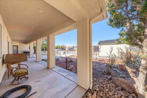 Fenced backyard with a patio area