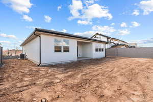 Back of property featuring a patio area, a fenced backyard, and stucco siding