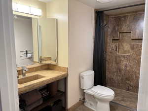 Bathroom with vanity and a shower stall