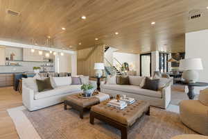 Living area featuring wood ceiling, light wood-type flooring, and recessed lighting