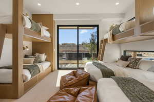 Bedroom with carpet floors, access to outside, and recessed lighting