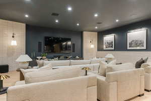 Cinema featuring recessed lighting and light wood finished floors
