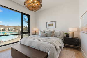 Bedroom with light wood-style floors and baseboards