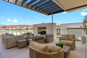 View of patio with an outdoor living space with a fireplace, a pergola, and a mountain view