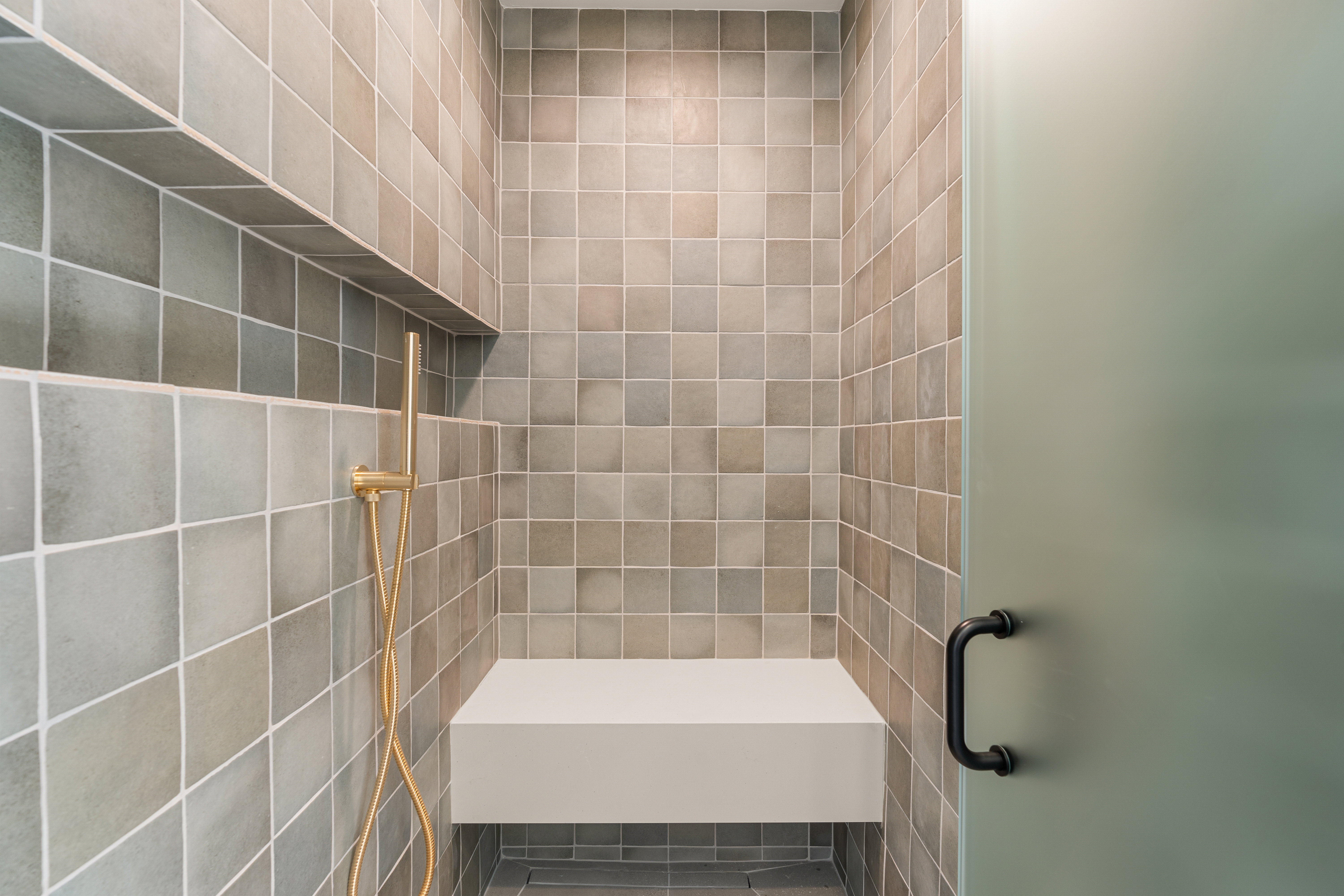 Full bathroom with a tile shower