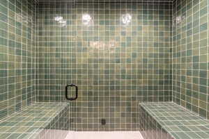 Bathroom featuring tiled shower