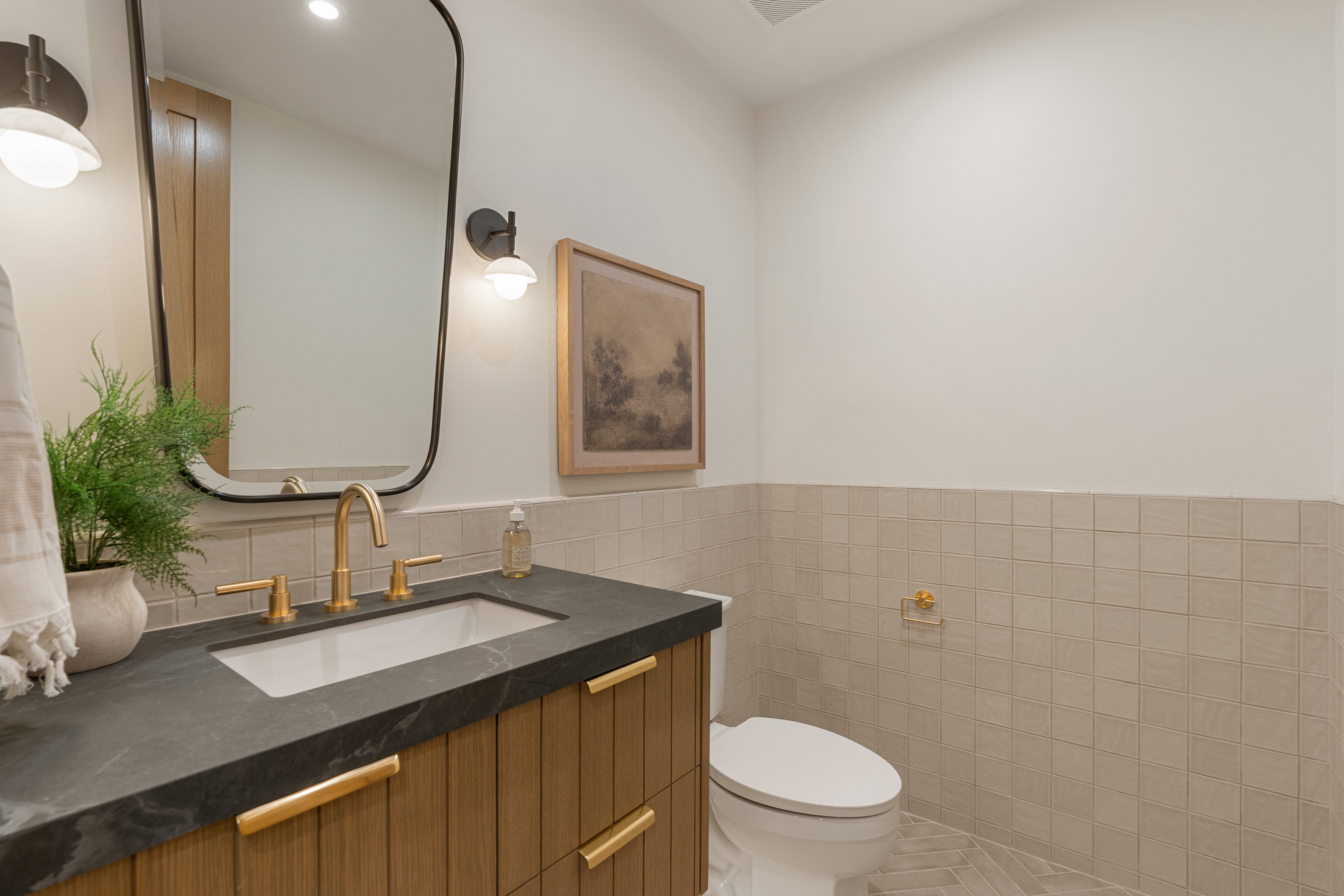 Bathroom with vanity, tile walls, a wainscoted wall, and recessed lighting