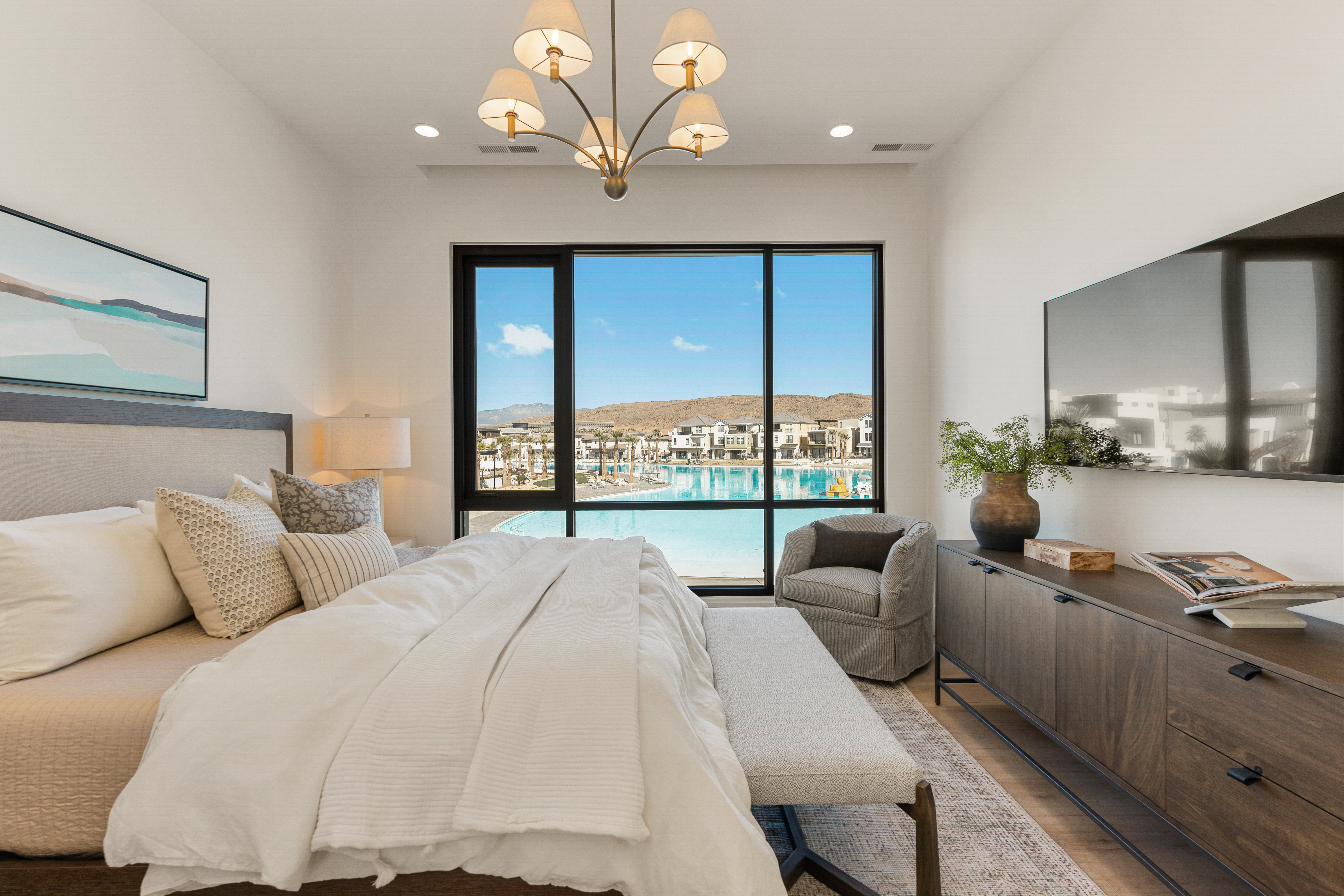 Bedroom featuring suspended lighting and wood finished floors