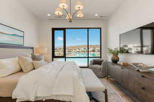 Bedroom featuring suspended lighting and wood finished floors