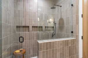 Bathroom featuring a tile shower