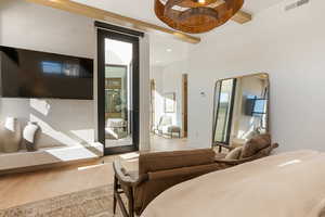 Bedroom featuring wood finished floors and baseboards
