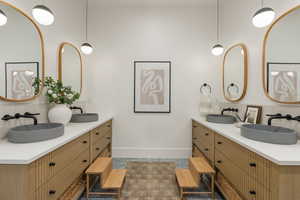 Bathroom with backsplash and double vanity