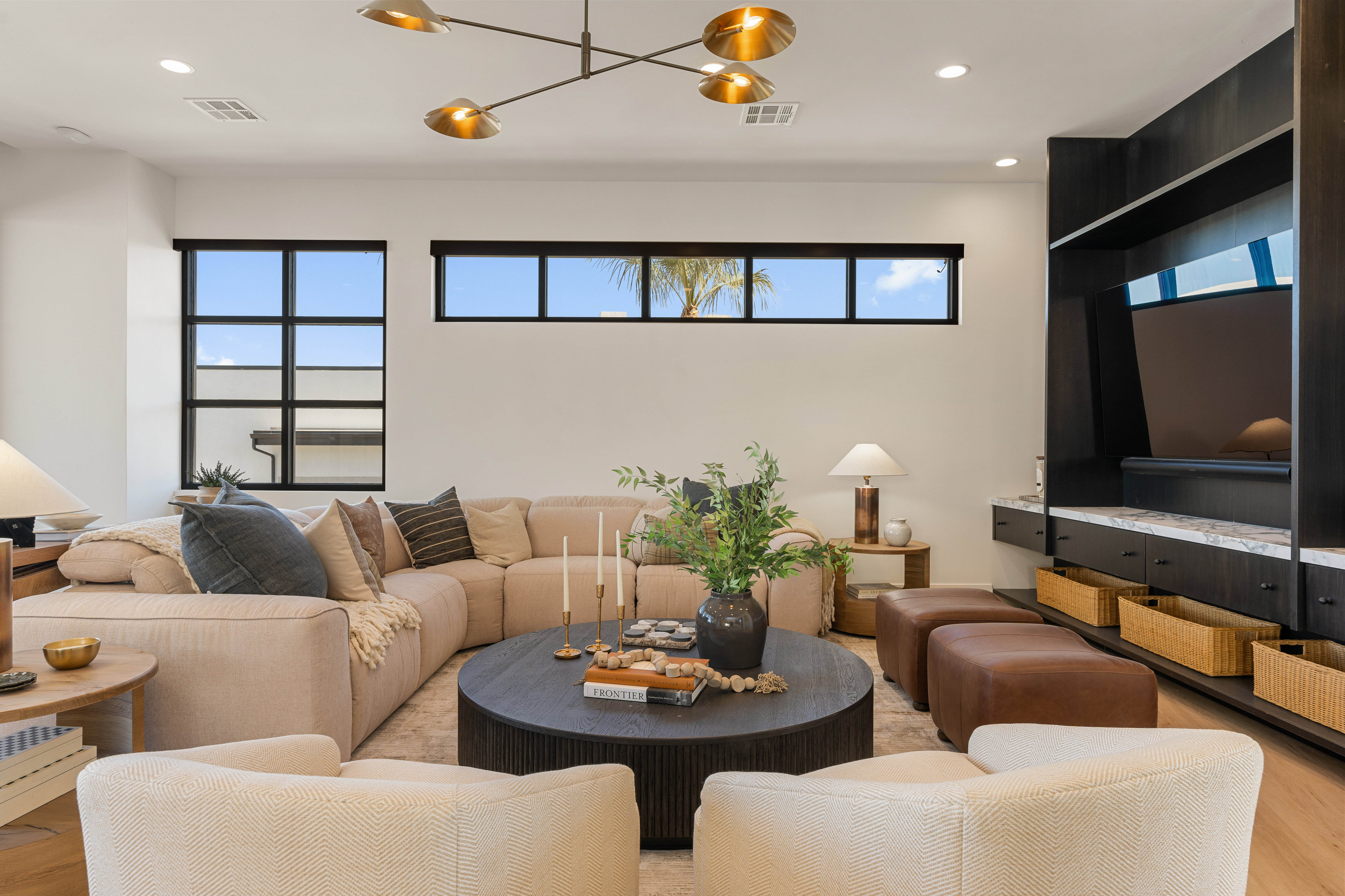 Living room with wood finished floors and recessed lighting