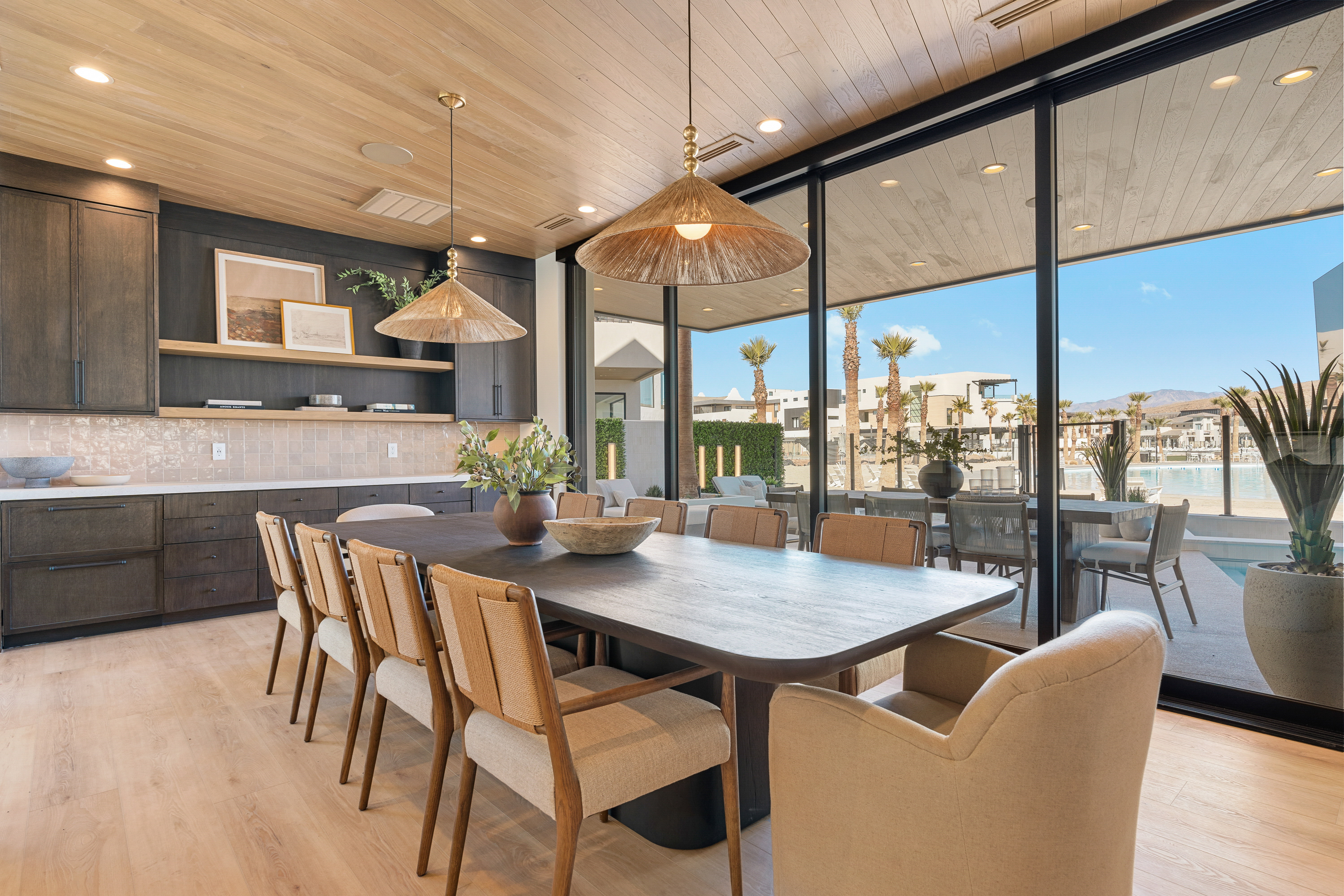 Dining area featuring floor to ceiling windows, light wood-type flooring, wooden ceiling, and recessed lighting