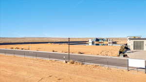 View of yard with a view of countryside, a garage, and driveway