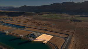 Aerial view of property and surrounding area featuring a water and mountain view and rural landscape