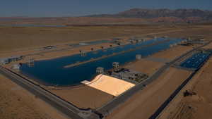 Aerial overview of property's location featuring a water and mountain view