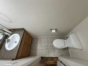 Half bath featuring vanity and toilet