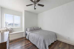 Bedroom featuring dark wood-style flooring and a ceiling fan