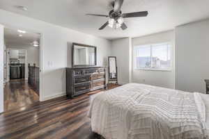 Bedroom featuring dark wood-style floors and a ceiling fan