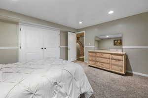 Bedroom featuring light carpet, a closet, and recessed lighting