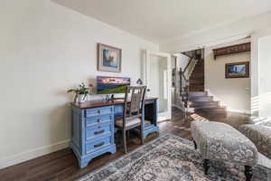 Office with baseboards and dark wood-style floors