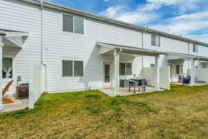 Rear view of property featuring a patio area
