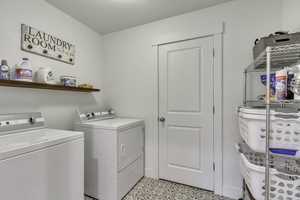 Laundry room featuring independent washer and dryer