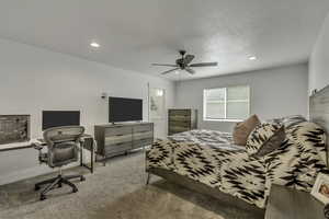 Bedroom with carpet, ceiling fan, recessed lighting, a desk, and connected bathroom