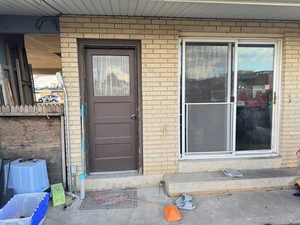 Property entrance with brick siding