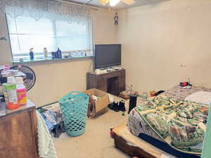 Bedroom featuring carpet and ceiling fan
