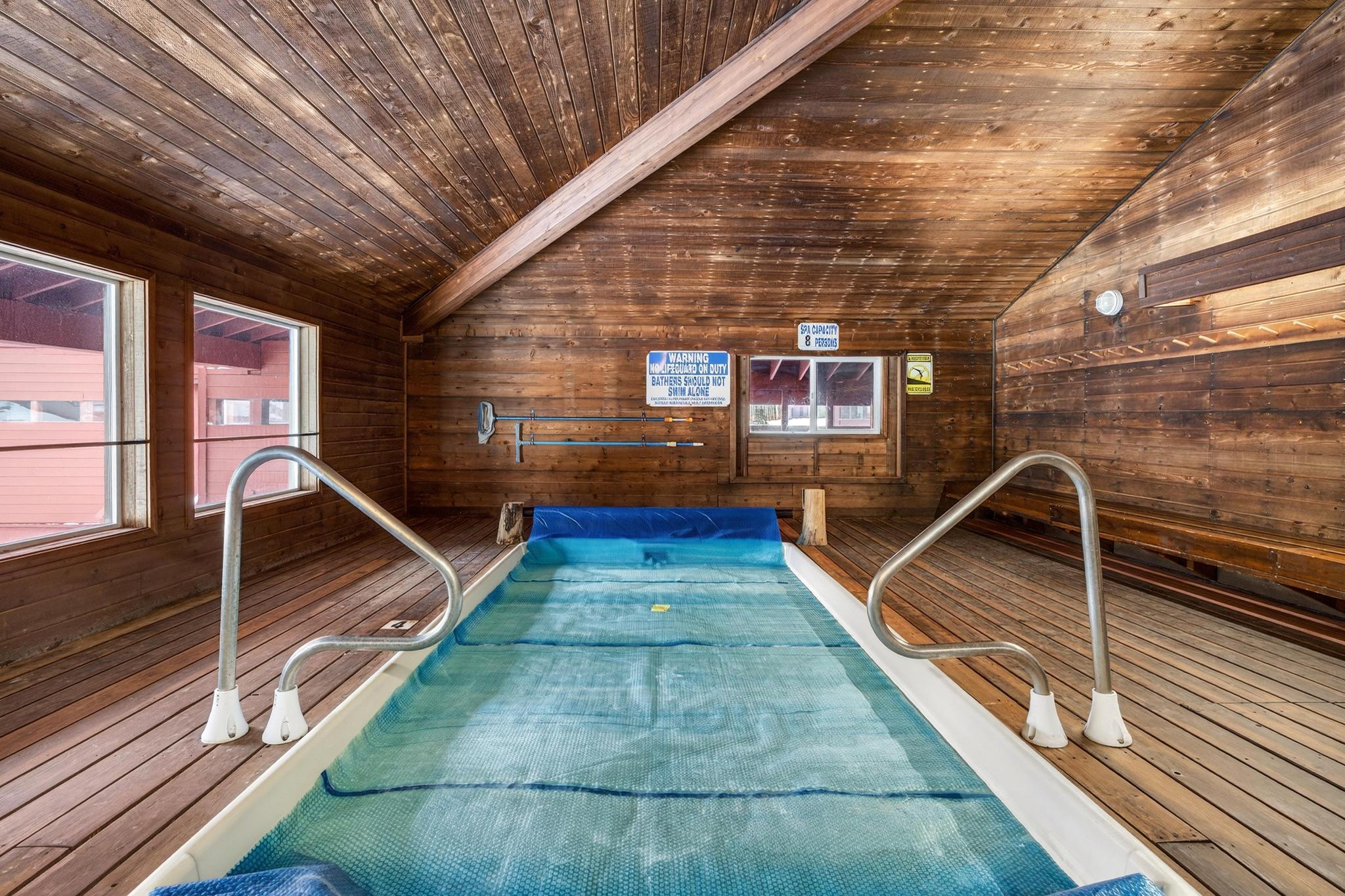 View of pool featuring a hot tub