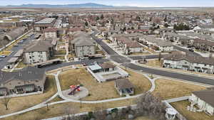 Aerial overview of property's location featuring nearby suburban area and mountains