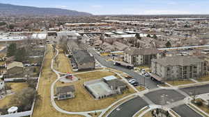 Aerial view of property's location featuring a mountainous background