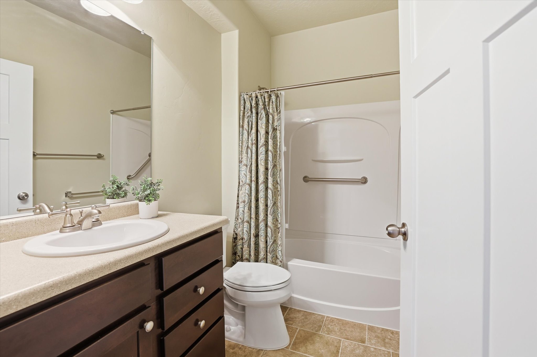 Main full bathroom,  featuring vanity and shower / bath combo with shower curtain