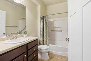 Main full bathroom,  featuring vanity and shower / bath combo with shower curtain