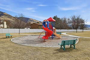 Communal playground featuring a mountain view