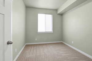 Secondary bedroom  with baseboards and a textured ceiling