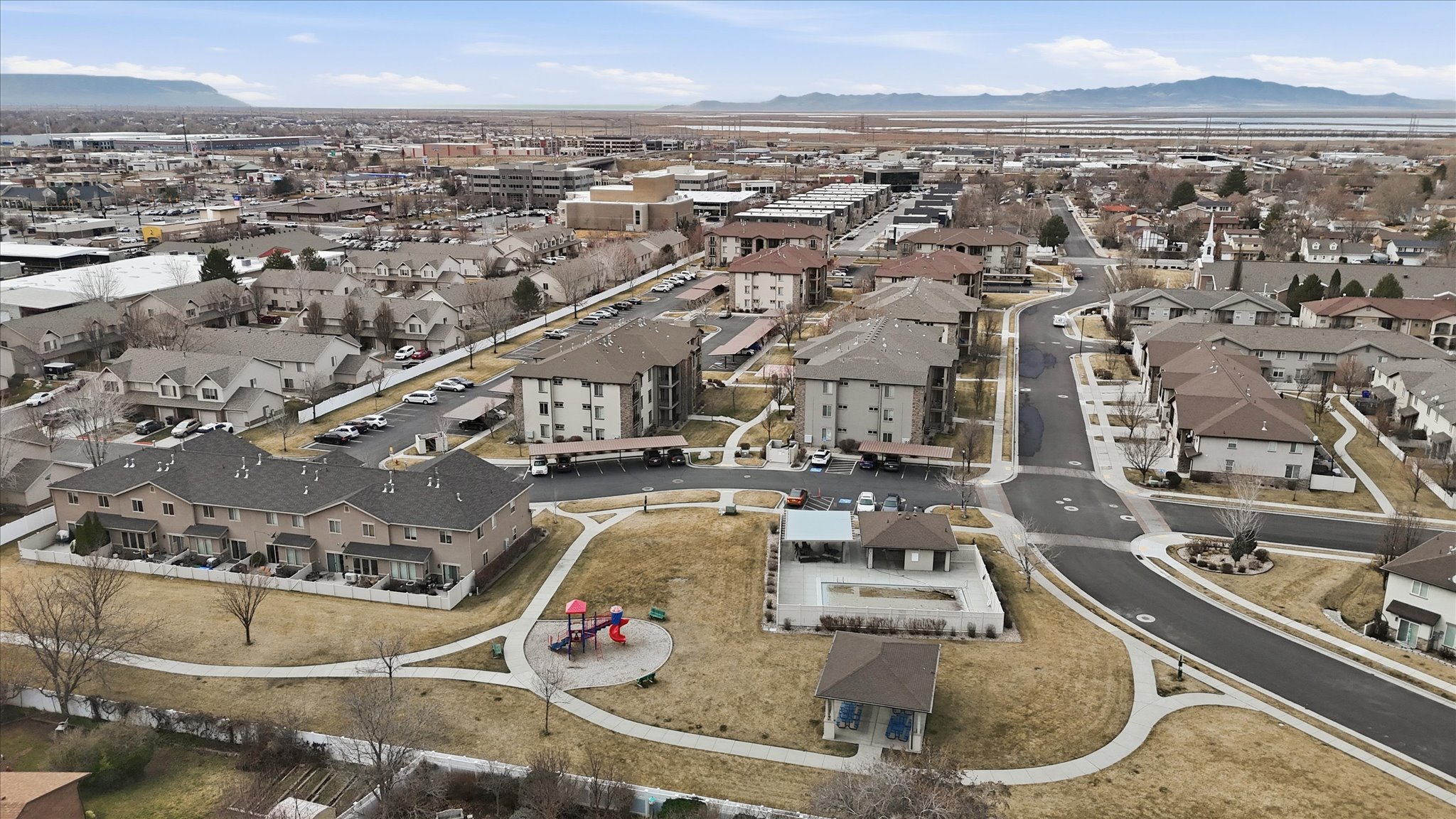 View of property location featuring nearby suburban area and a mountain backdrop