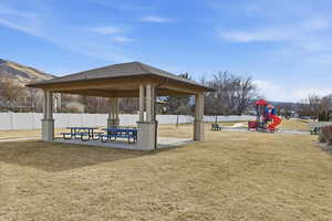 View of community featuring a patio area and a gazebo