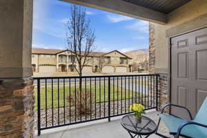 View of front patio and storage room.
