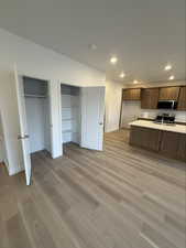 Kitchen featuring light countertops, stainless steel appliances, light wood-type flooring, and recessed lighting